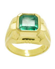 Solid yellow gold ring with emerald