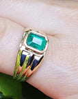 Solid yellow gold ring with emerald