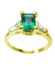 A natural emerald ring topside view with side diamonds, the May's birthstone jewelry.