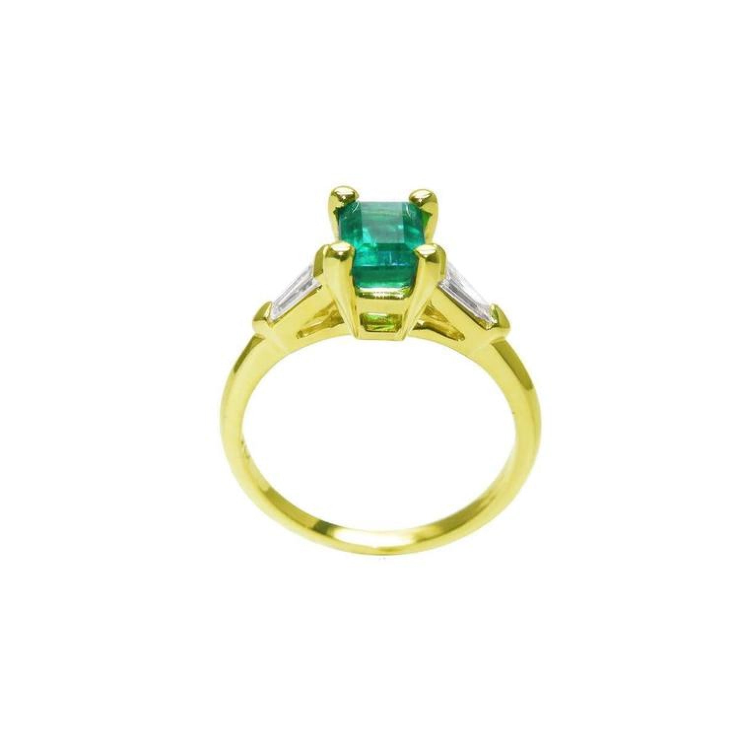 14K yellow gold ring with a vibrant emerald center stone and baguette side diamonds.