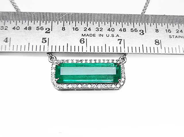 Solid gold emerald necklace east-west