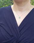 Round cut emerald diamond necklace