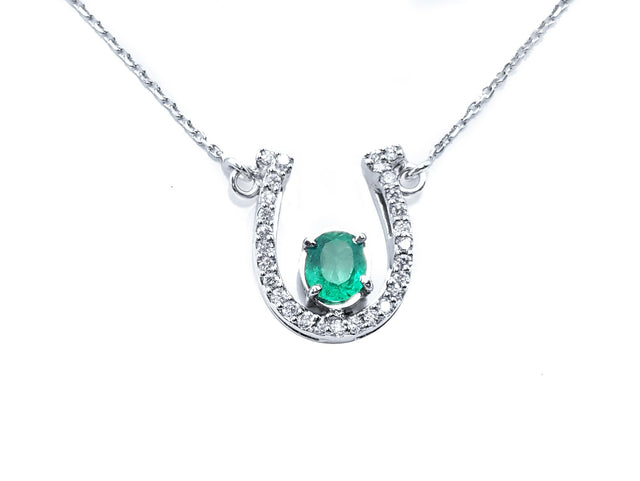 Horseshoe emerald diamond necklace