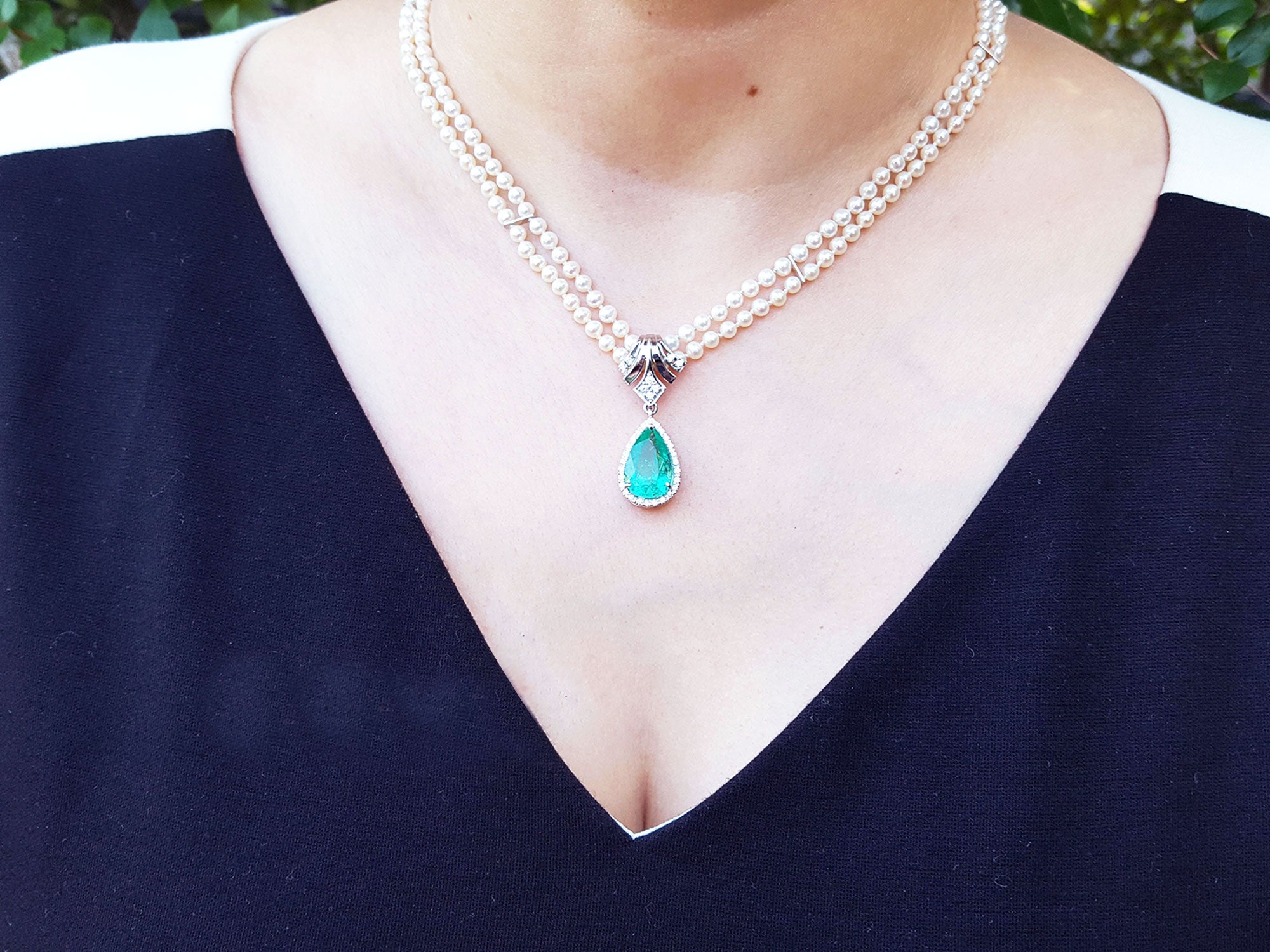 Enhancer emerald pendant