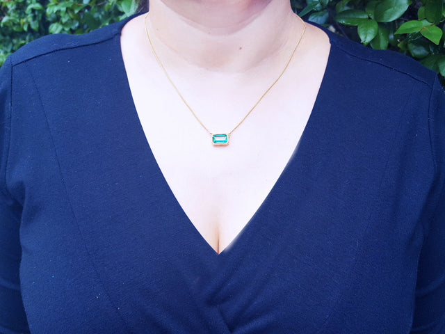 Emerald bezel set necklace