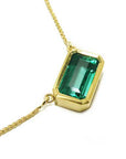 Deep green Colombian emerald bezel set necklace