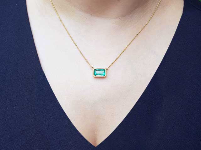 Emerald-cut bezel set emerald necklace