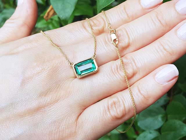 Emerald solitaire bezel set necklace