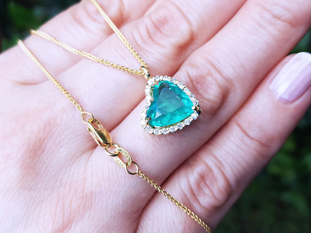 Solid yellow gold necklace with heart emerald