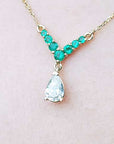 Pear cut diamond and emerald necklace