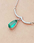 Pear cut emerald white gold necklace