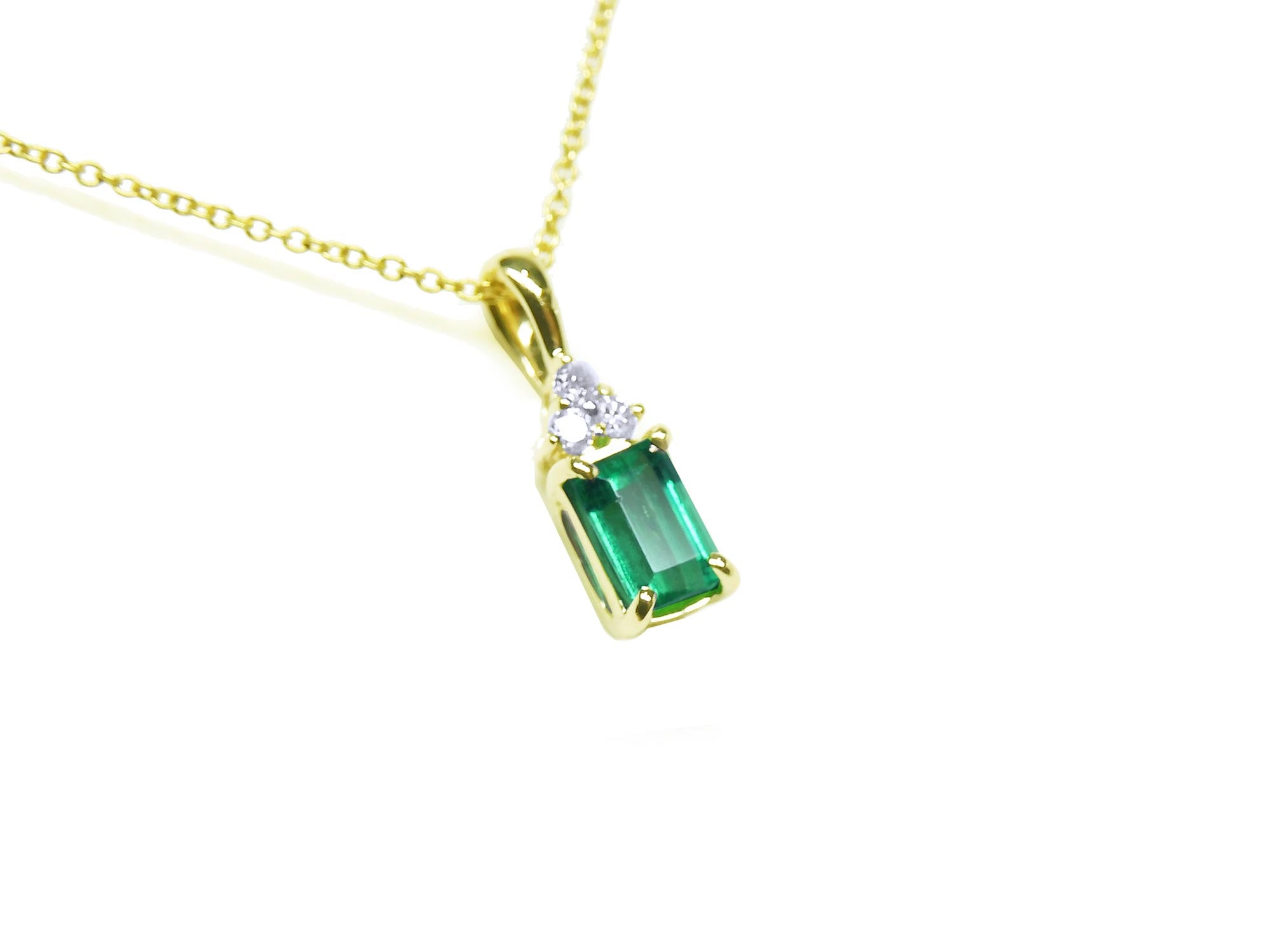 Yellow gold emerald necklace