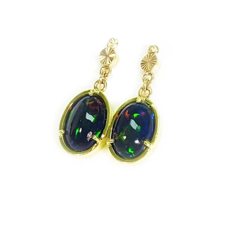 Ethiopian Welo black opal oval earrings with bluish-green and red-orange fire, set in 14K yellow gold.