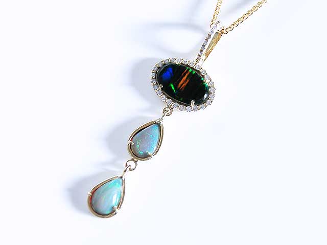 Solid yellow gold black opal pendant