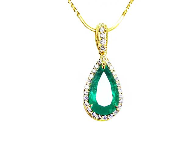 Solid gold emerald pendant