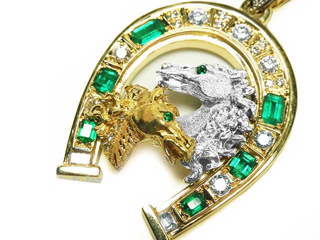 Horseshoe emerald pendant