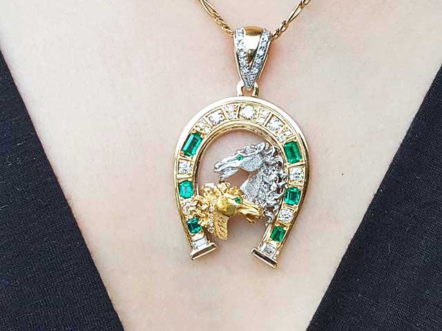 Genuine emeralds horseshoe pendant