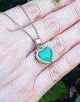 Solid white gold pendant with emerald