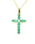 Cross pendant necklace with emeralds