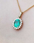 Solid gold emerald and diamond pendant necklace