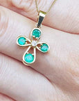 Solid yellow gold pendant with emeralds