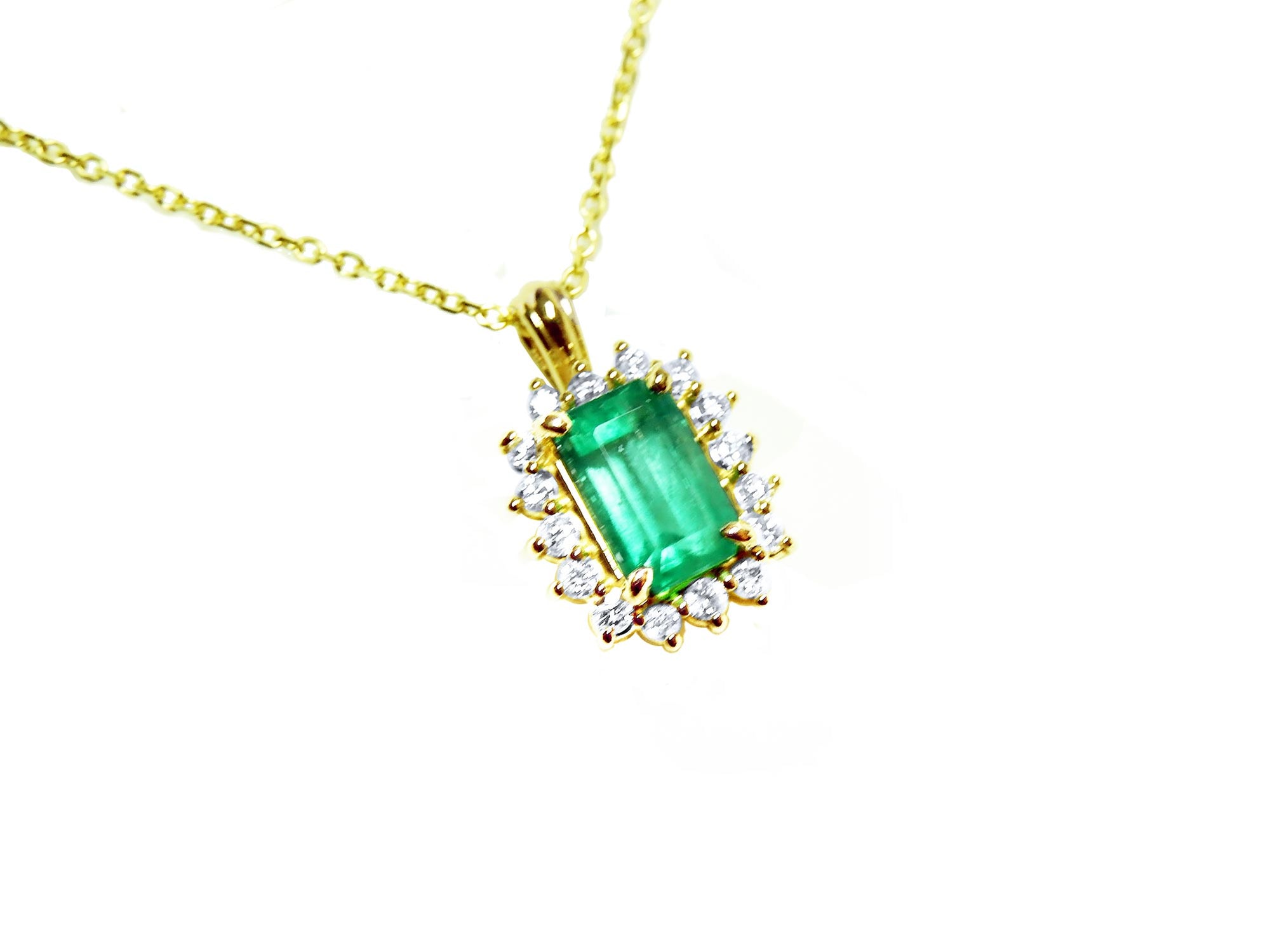 Halo Colombian emerald pendant