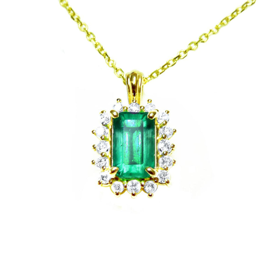 14k yellow gold necklace with a rectangular natural colombian emerald with halo diamond pendant.