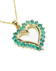 Solid yellow gold heart pendant necklace with emeralds