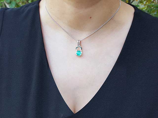 Emerald love knot pendant necklace