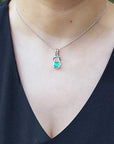 Emerald love knot pendant necklace