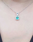 Emerald and diamond pendant necklace