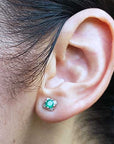 White solid gold tulip emerald stud earrings