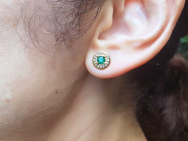 Yellow gold halo emerald stud earrings