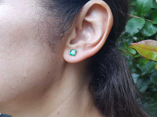May birthstone emerald stud earrings