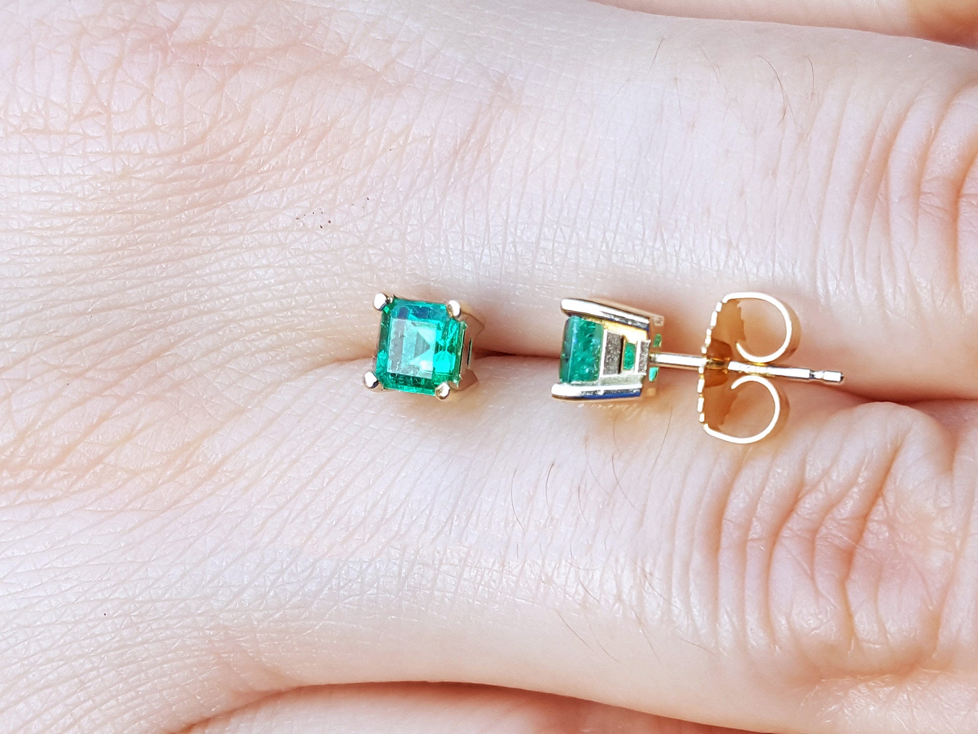 Puah backs emerald stud earrings