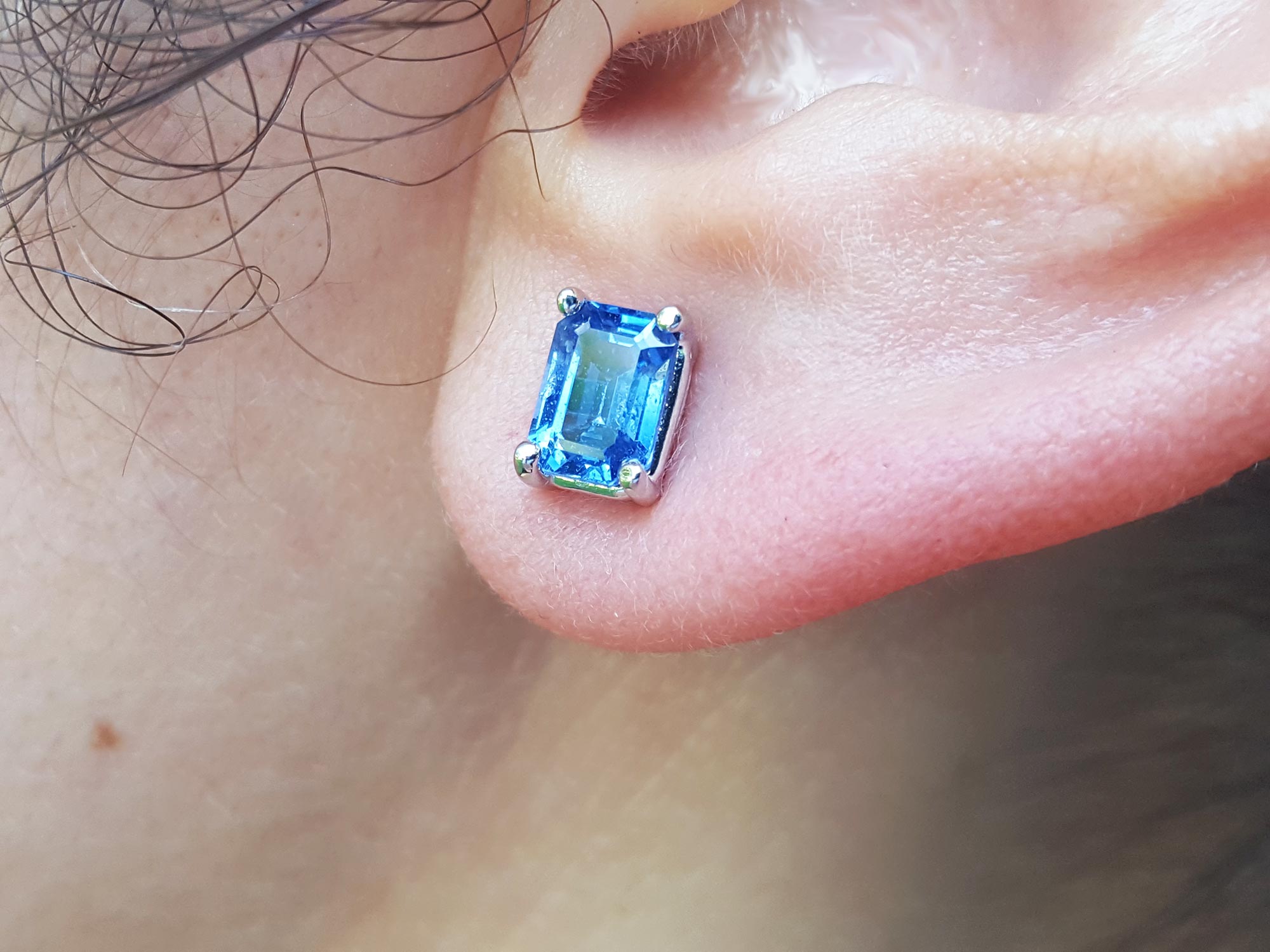 Emerald cut solitaire stud earrings