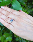 Emerald cut blue sapphire ring