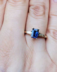 Emerald cut three stone sapphire ring