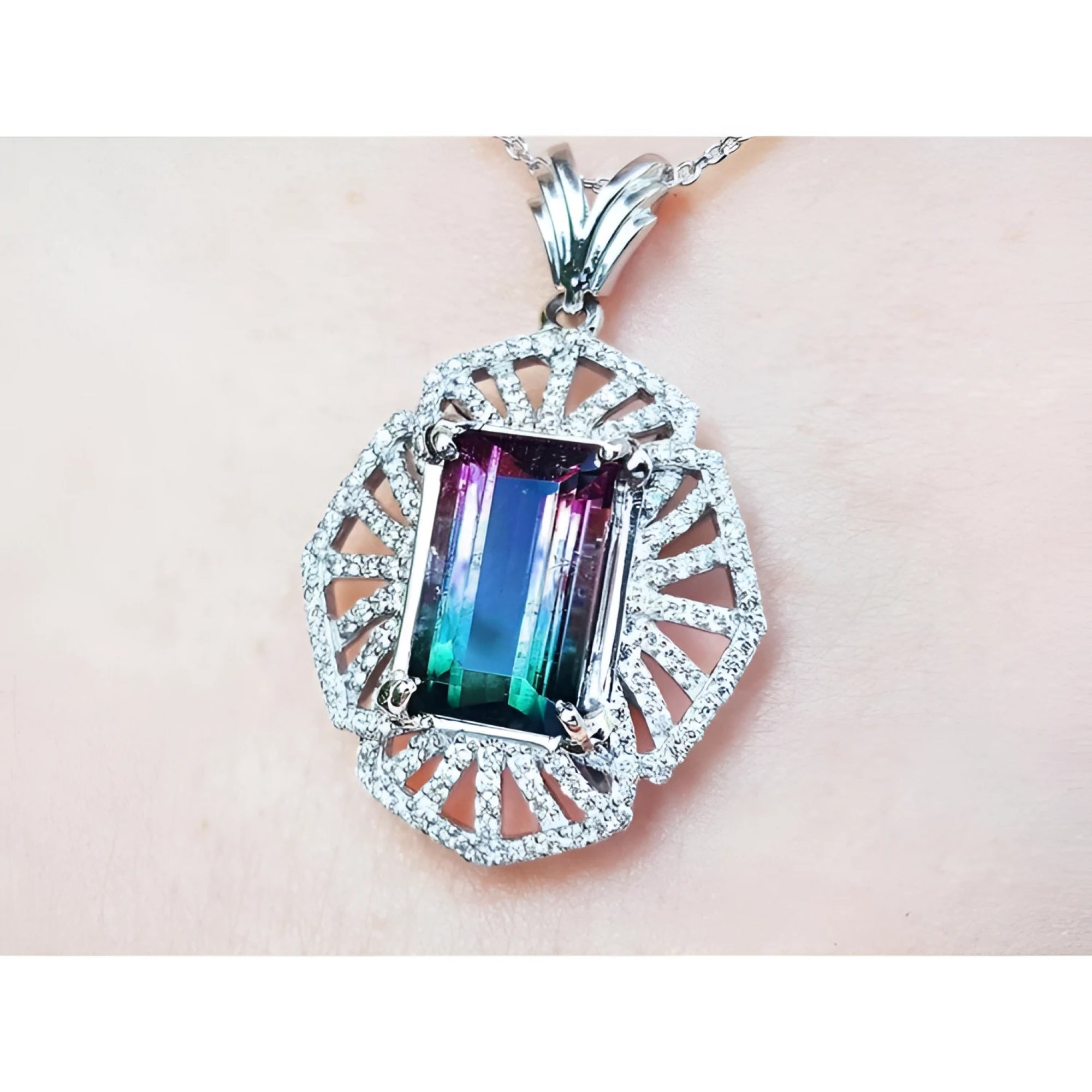 4.90 ct. watermelon tourmaline pendant, emerald cut, with diamonds on 14K white gold chain.