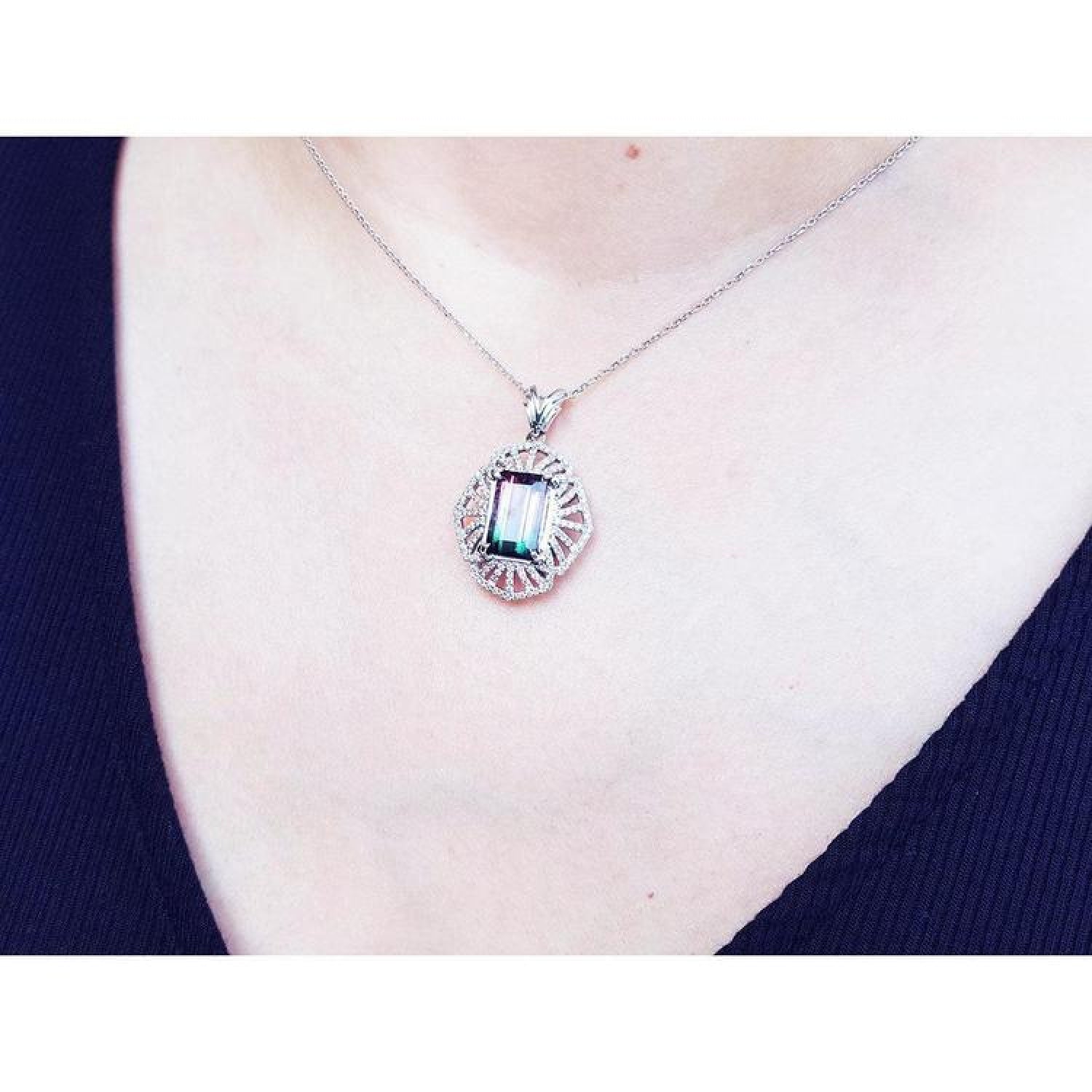 Watermelon tourmaline pendant necklace with emerald cut, bluish-green and pink stone, diamond accents, 14K white gold.