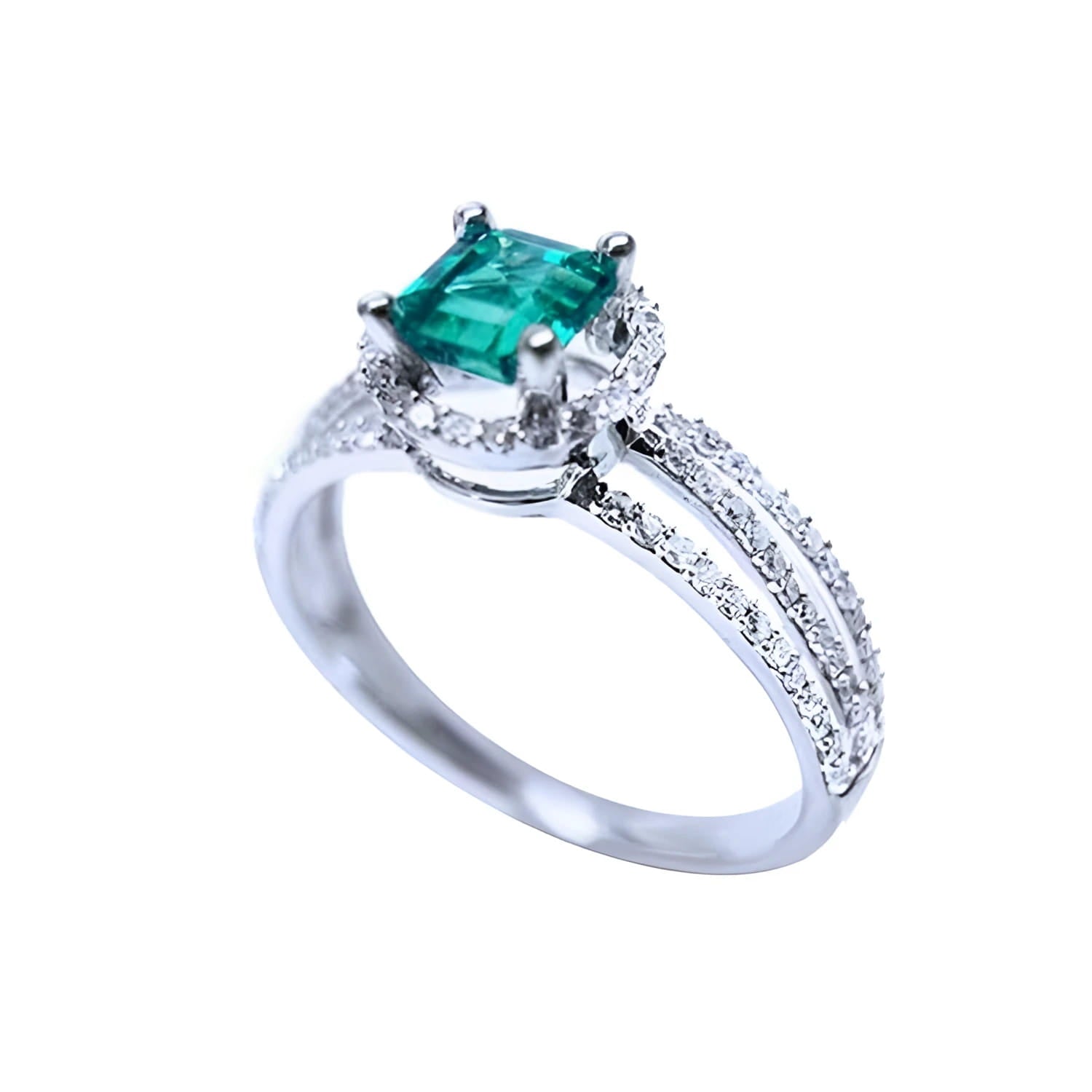 Emerald engagement ring with halo diamonds and three rows of diamonds on a 14K white gold band.