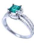 An affordable emerald engagement ring side profile view.