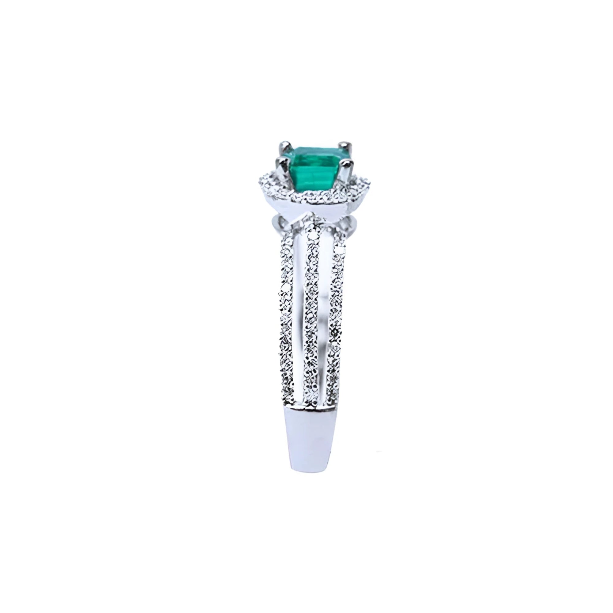 14K white gold engagement ring with a natural emerald centerpiece and three rows of prong-set diamonds.