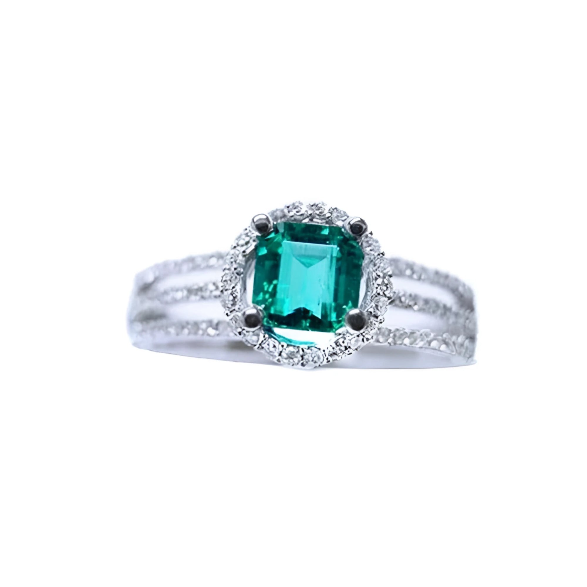 An affordable emerald engagement ring and diamond-studded band crafted in 14k white gold.