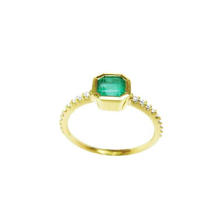 14K yellow gold ring with a medium green emerald in a tapered bezel, flanked by natural diamonds.