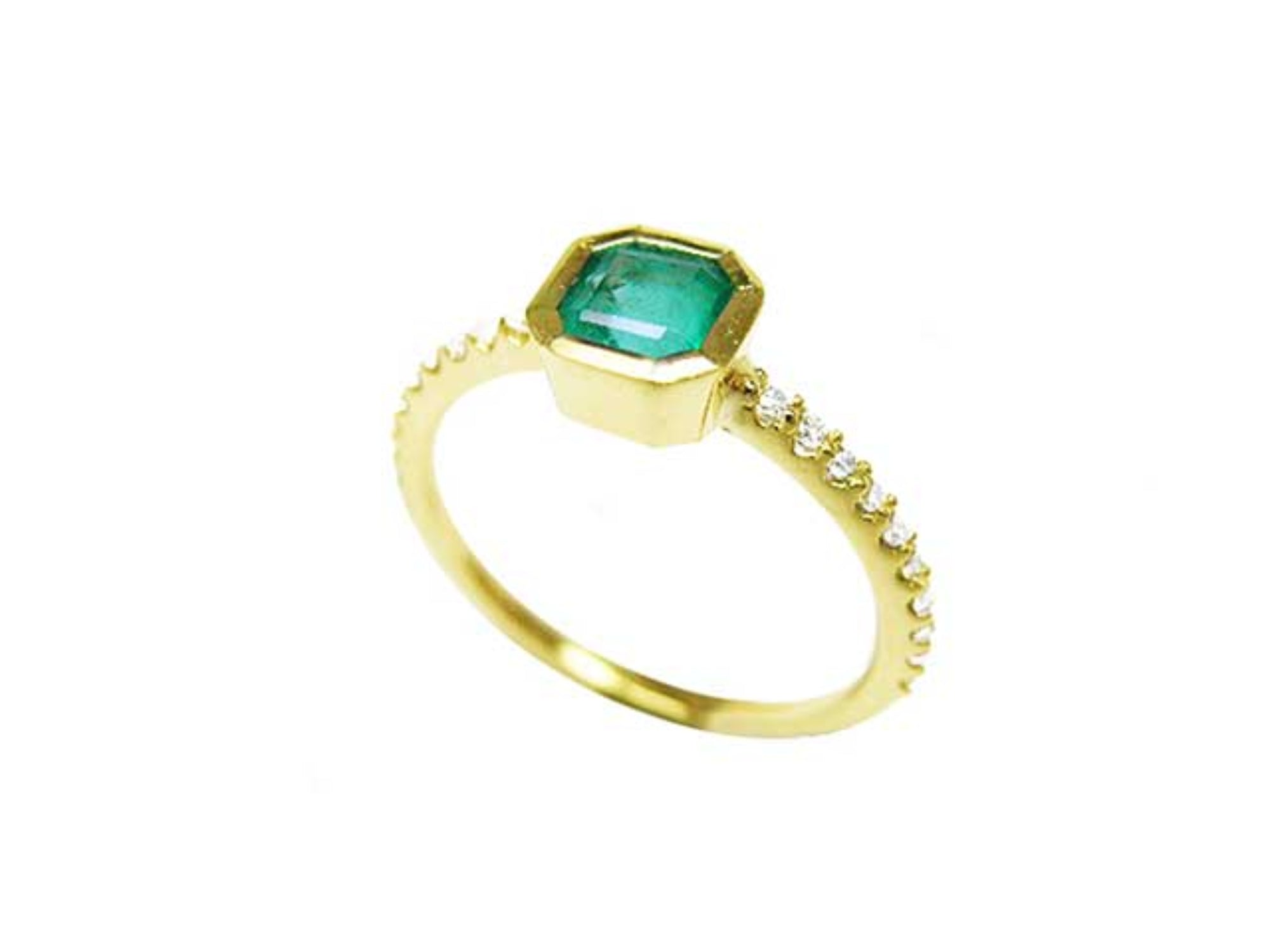 From a partial side angle, this emerald ring displays the top setting, and the band design.