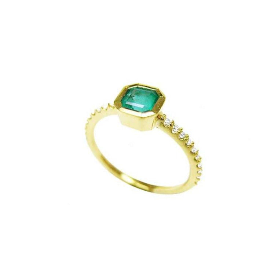 14K yellow gold ring with a bezel-set octagonal emerald and diamond accents on the band.
