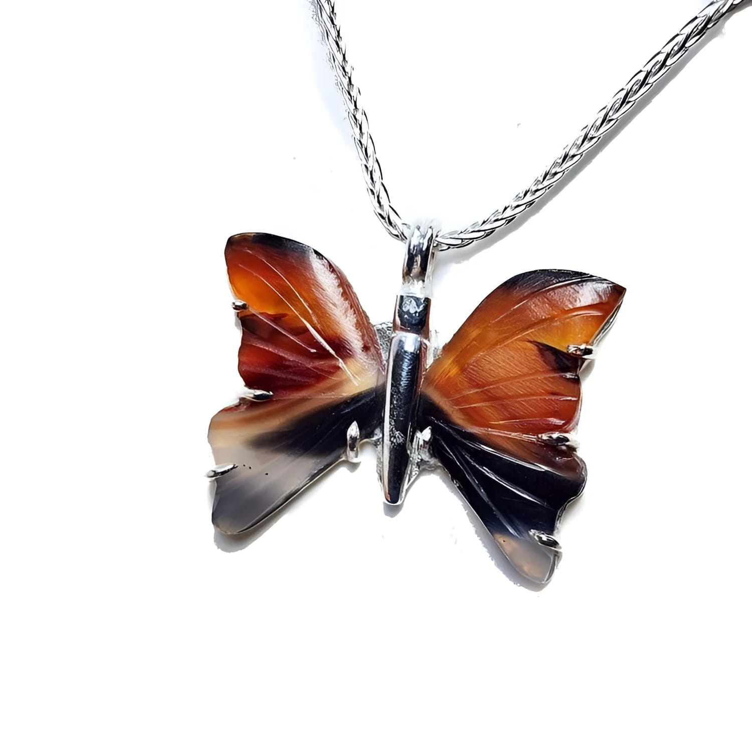 Sterling silver necklace with an orange, brown, and black agate butterfly pendant.