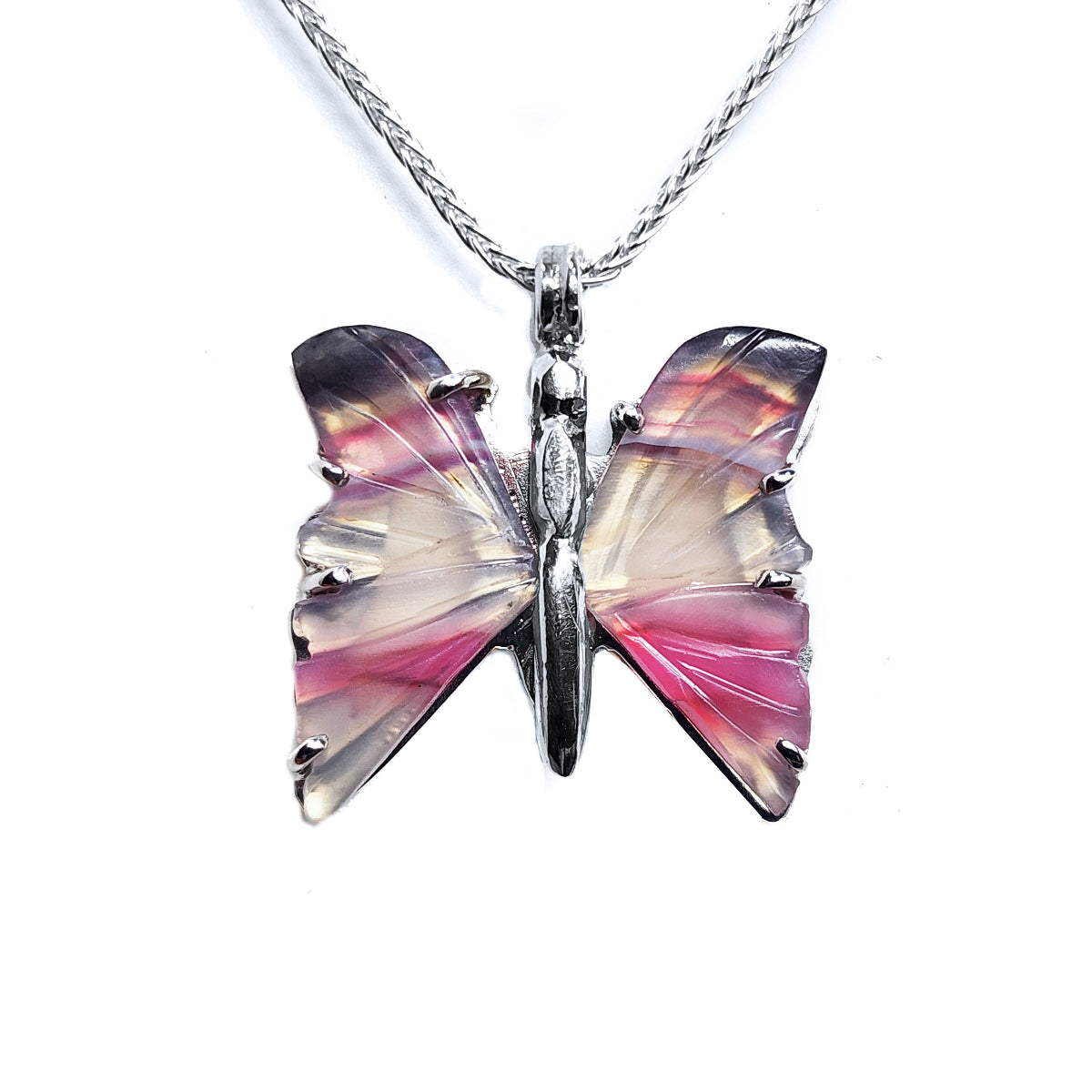 Butterfly-shaped agate sterling silver pendant with pink and purple wings on a white background