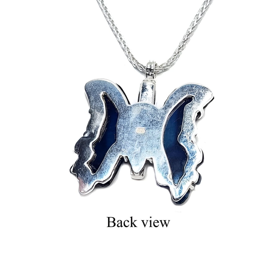 Back view of dark blue natural agate butterfly pendant in sterling silver.